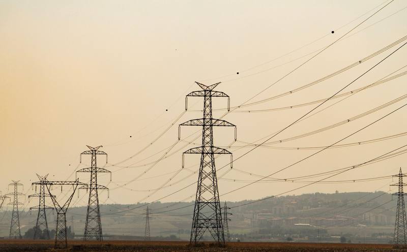High-voltage pylons at dusk