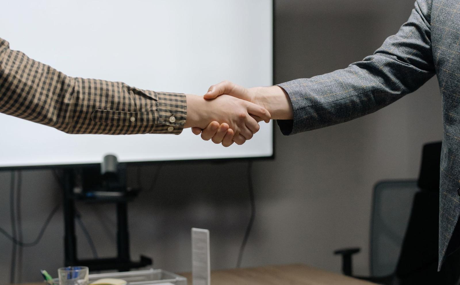 A handshake in a meeting room